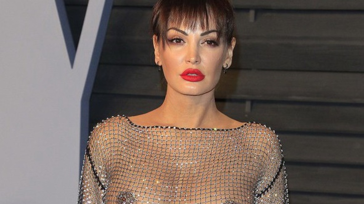 Albanian singer shows off her assests in see-through gown at Oscars Vanity Fair party! (photos)